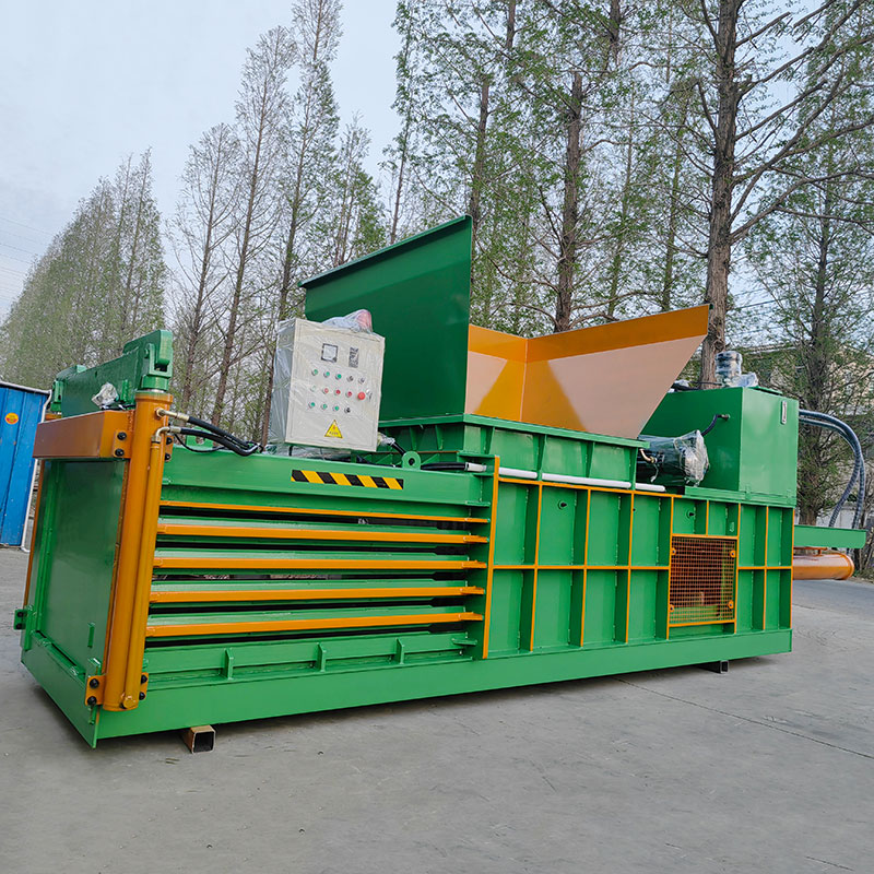 Closed door baler for safety and easy material handling.