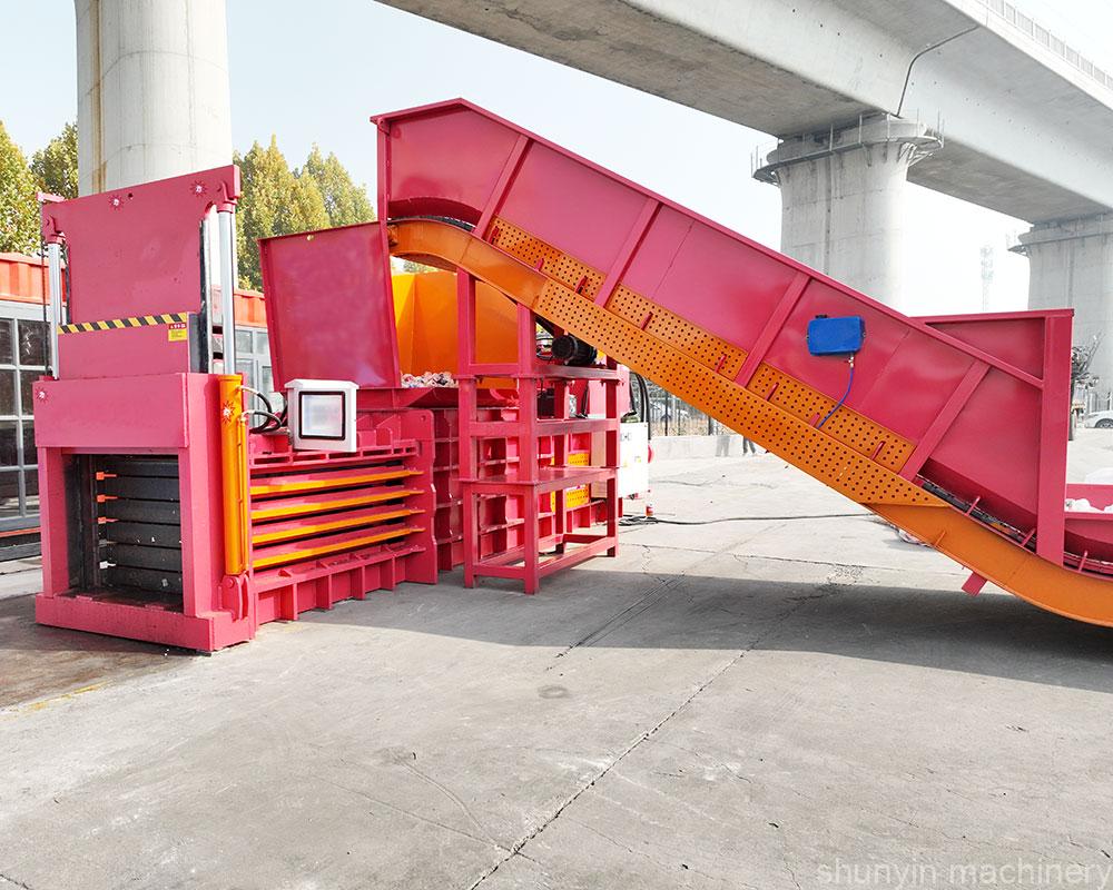 Horizontal baling press for large-scale and efficient waste operations.