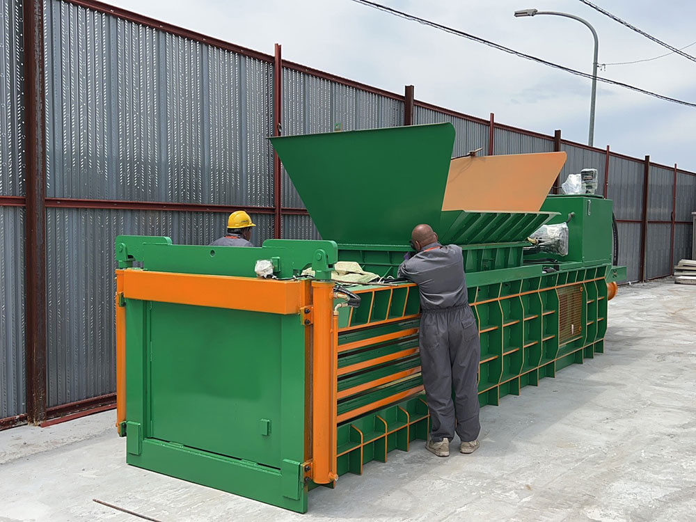 Horizontal baler for efficient and compact waste recycling and storage.