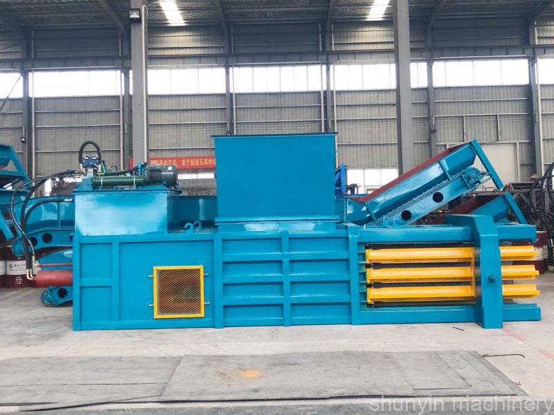 Horizontal baling press machine for optimized material compaction and storage.