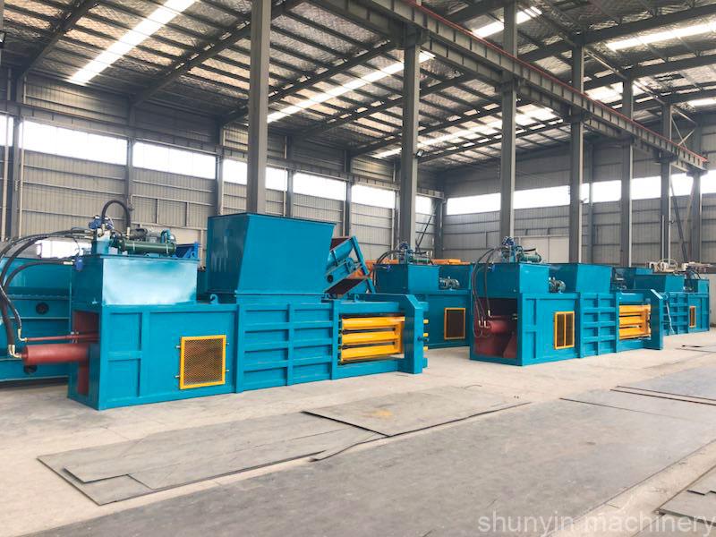 Hydraulic baler for versatile waste management and material processing.