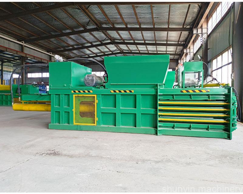 Heavy-duty horizontal baler for industrial-grade waste compaction and recycling.