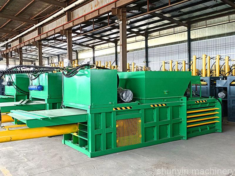 Semi-automatic horizontal baling machine for cost-effective waste handling.  