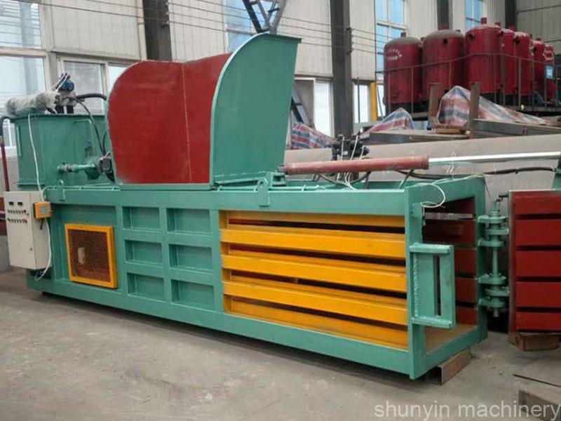 Horizontal baling press for cardboard, paper, and waste recycling