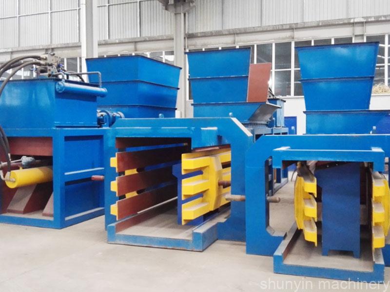 Horizontal cardboard baler for efficient recycling of cardboard and paper waste.