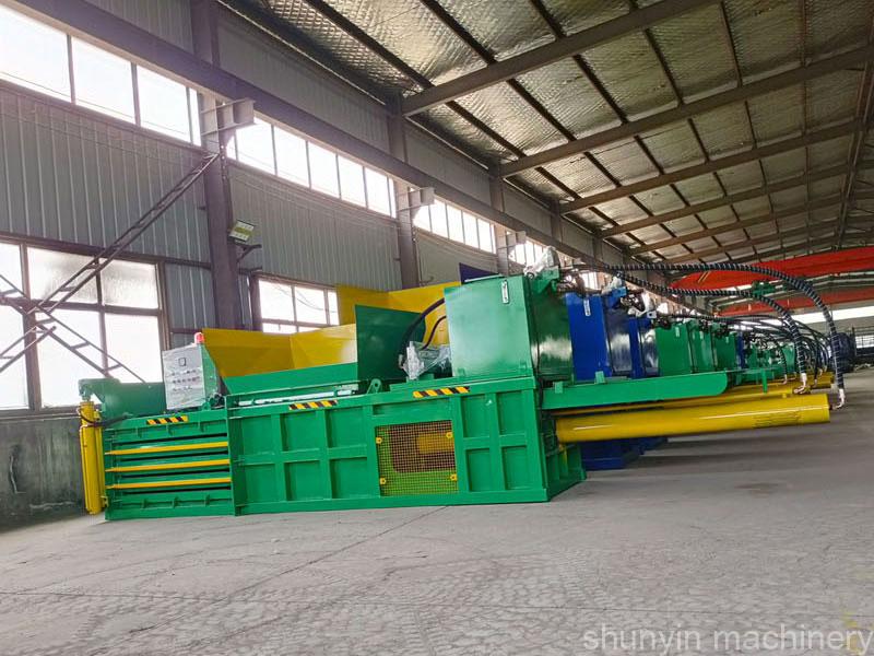 Horizontal waste baling machine: Shunyin's machine for horizontal waste baling operations.