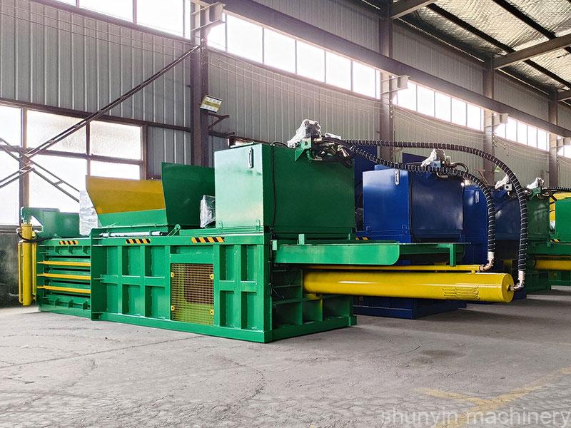 Advanced horizontal recycling compactor machine for sustainable waste management.