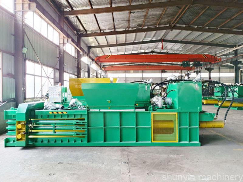 Industrial hydraulic baling press for efficient waste compaction