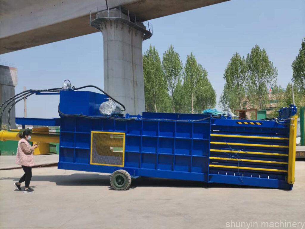 Fully automatic horizontal baler for efficient waste management