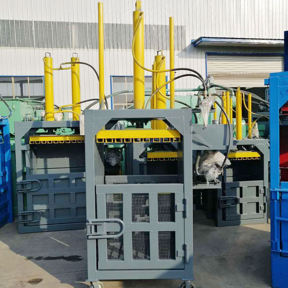 High-capacity waste baler for large-scale operations