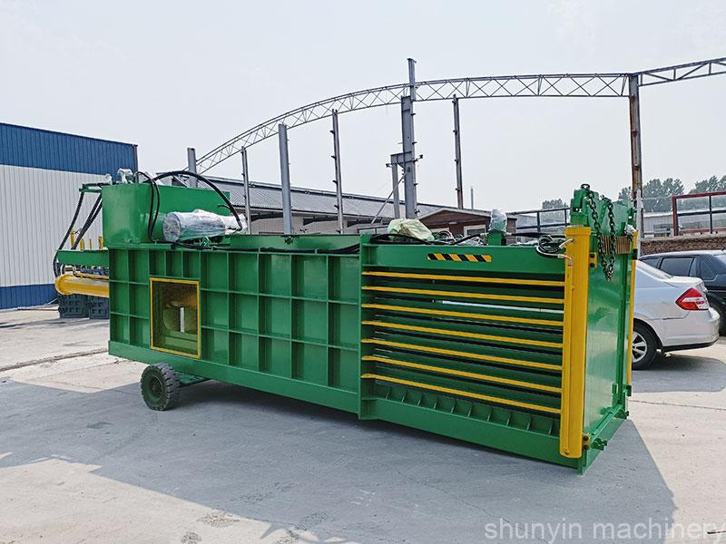 Horizontal hydraulic baler for industrial waste compaction and recycling