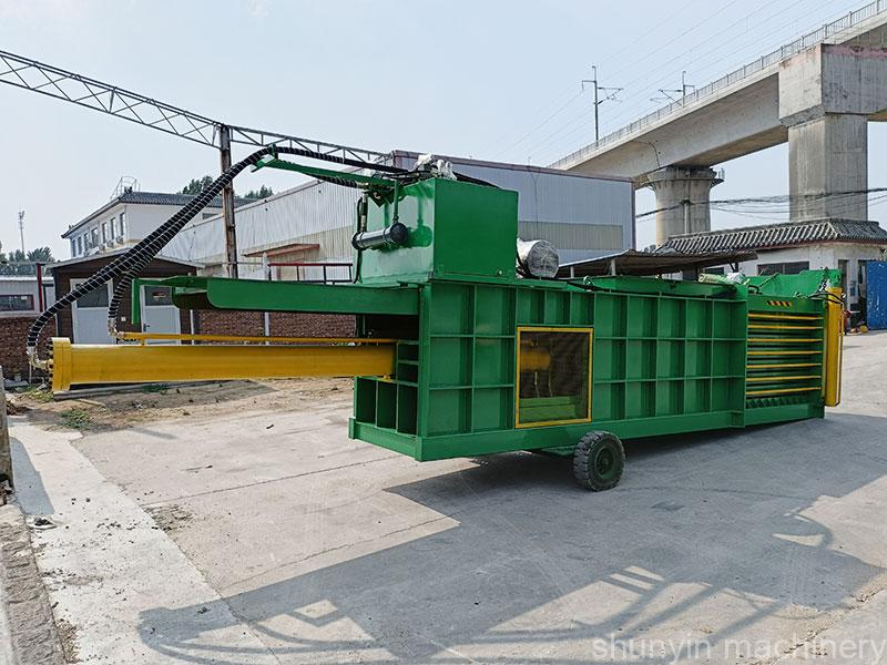 Advanced horizontal baling machine for effective paper waste handling.