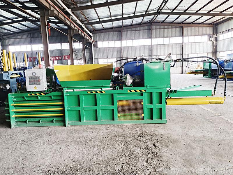 Advanced horizontal waste recycling baler for sustainable practices.