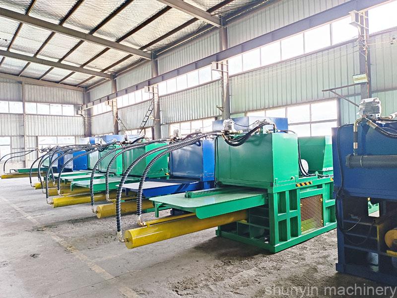 Automatic tie horizontal baler with hydraulic waste compaction features