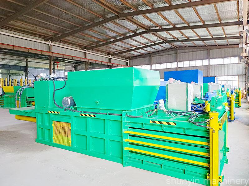 Horizontal baler for waste recycling and compacting materials efficiently