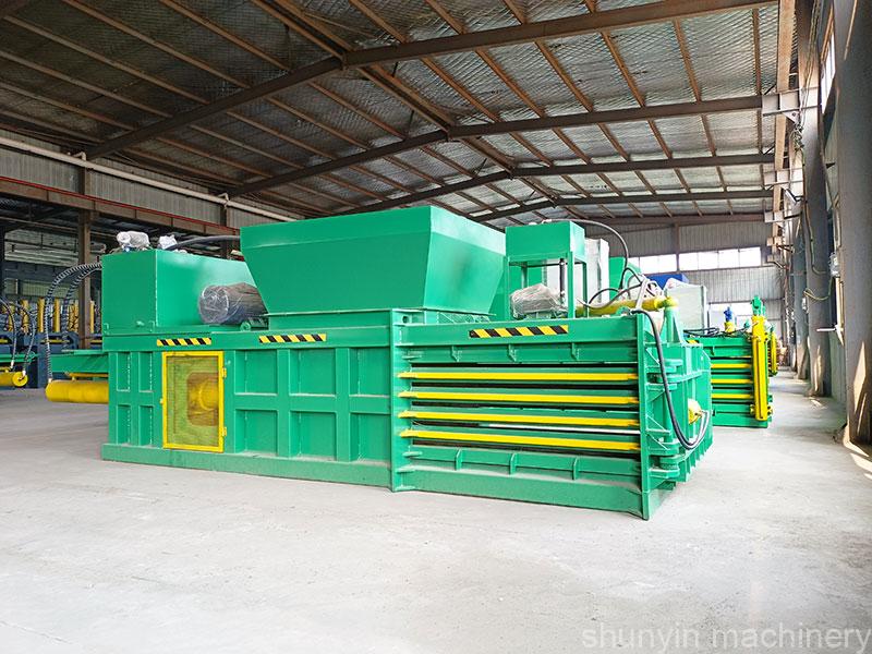 Industrial hydraulic horizontal baling machine for waste management systems