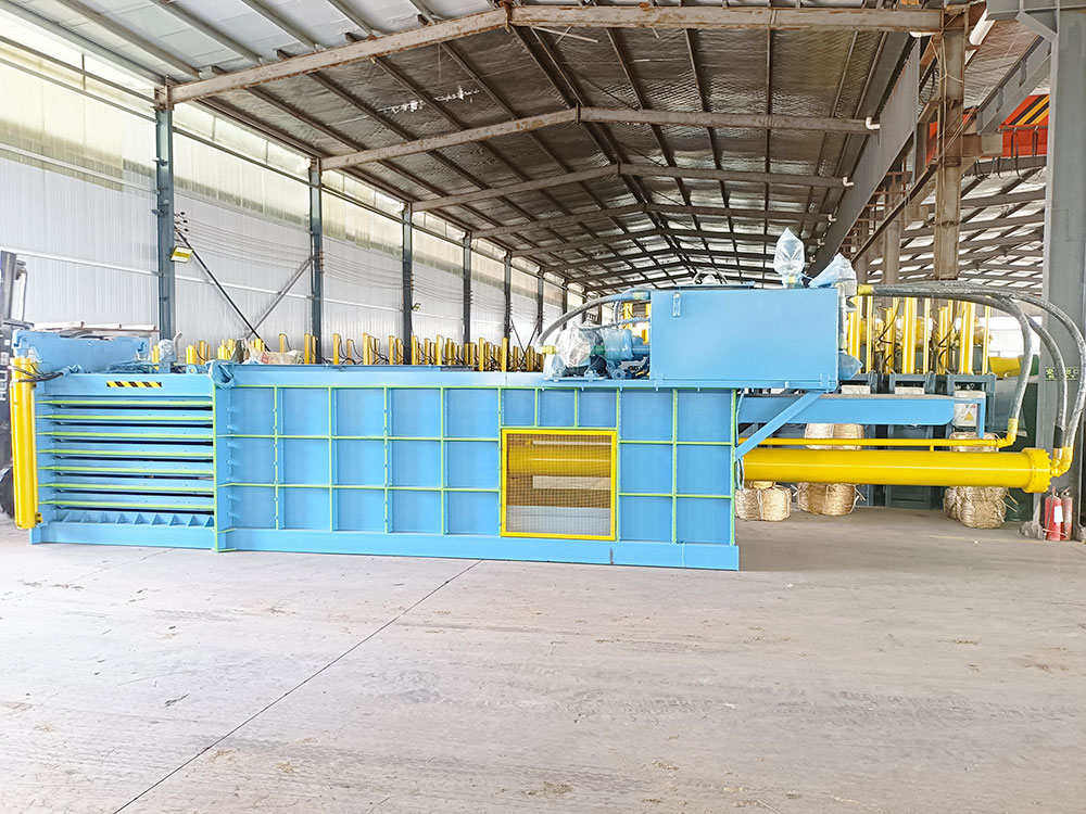 Horizontal cardboard baler for sale, ideal for industrial use.