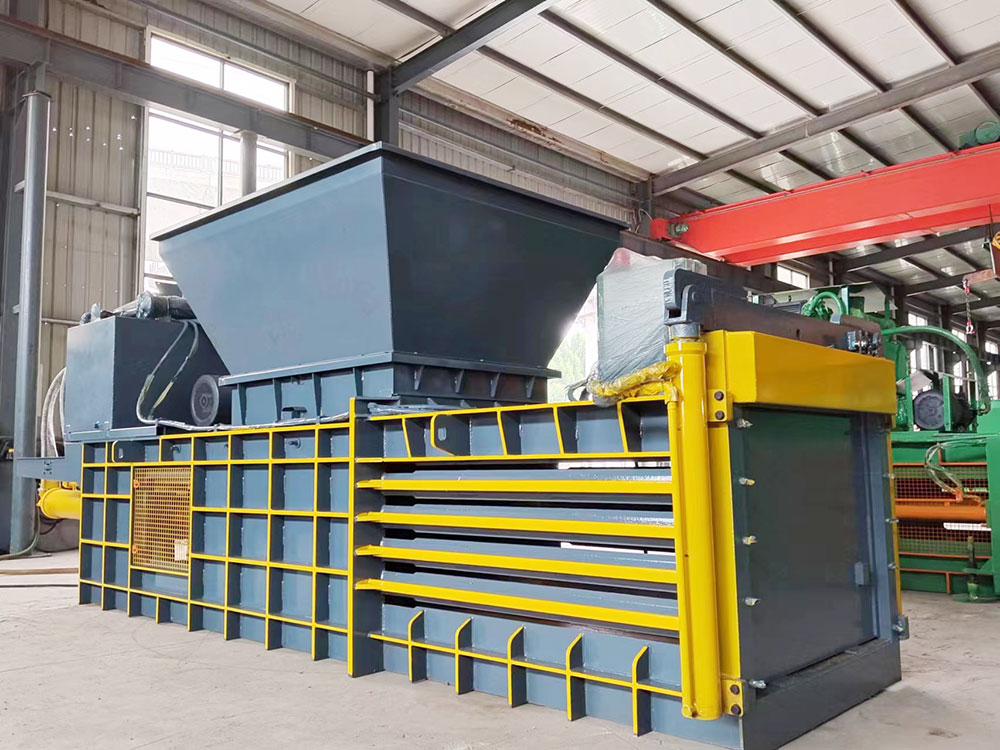 Cardboard baler machine designed for fast, efficient material handling.