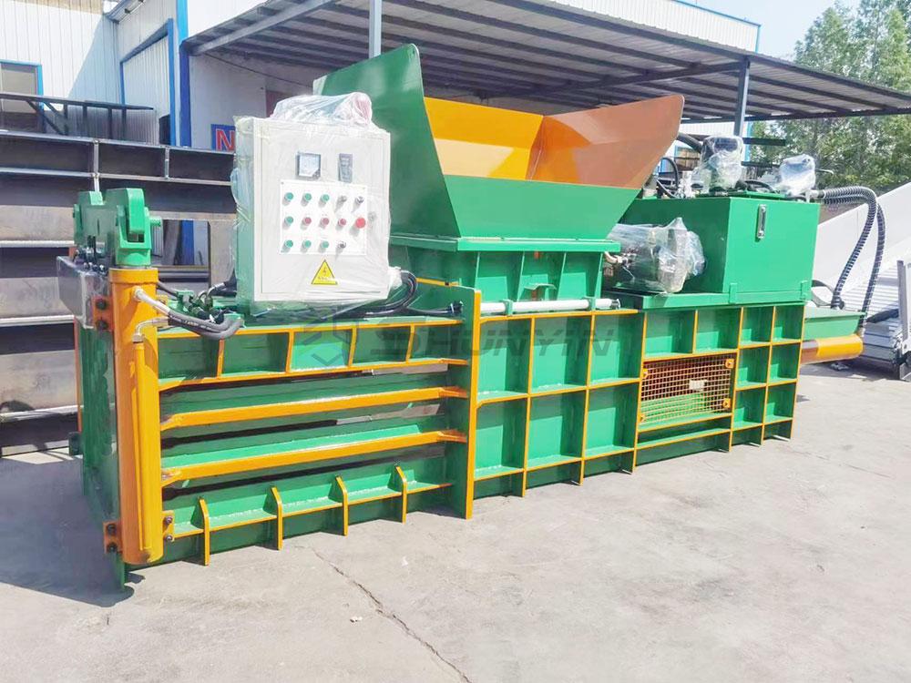 Hydraulic waste baling press for efficient material compression