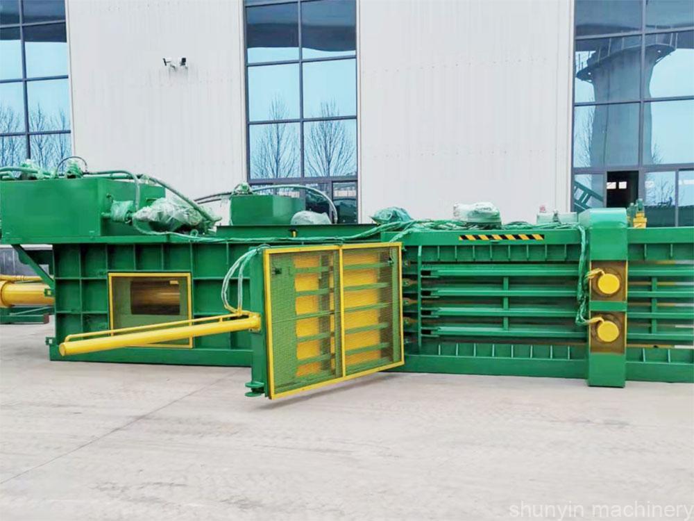 Baling machine for waste handling, designed for high-capacity waste management.