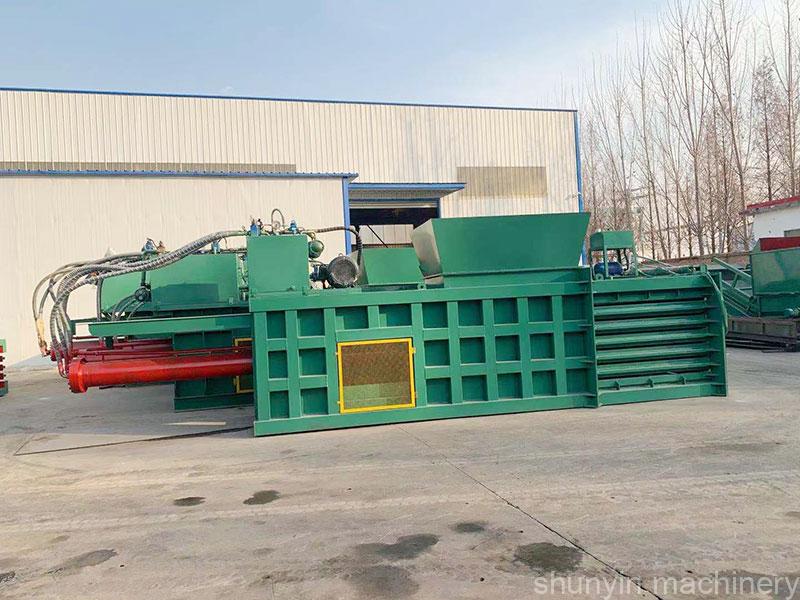 Horizontal baler for industrial paper recycling and waste handling