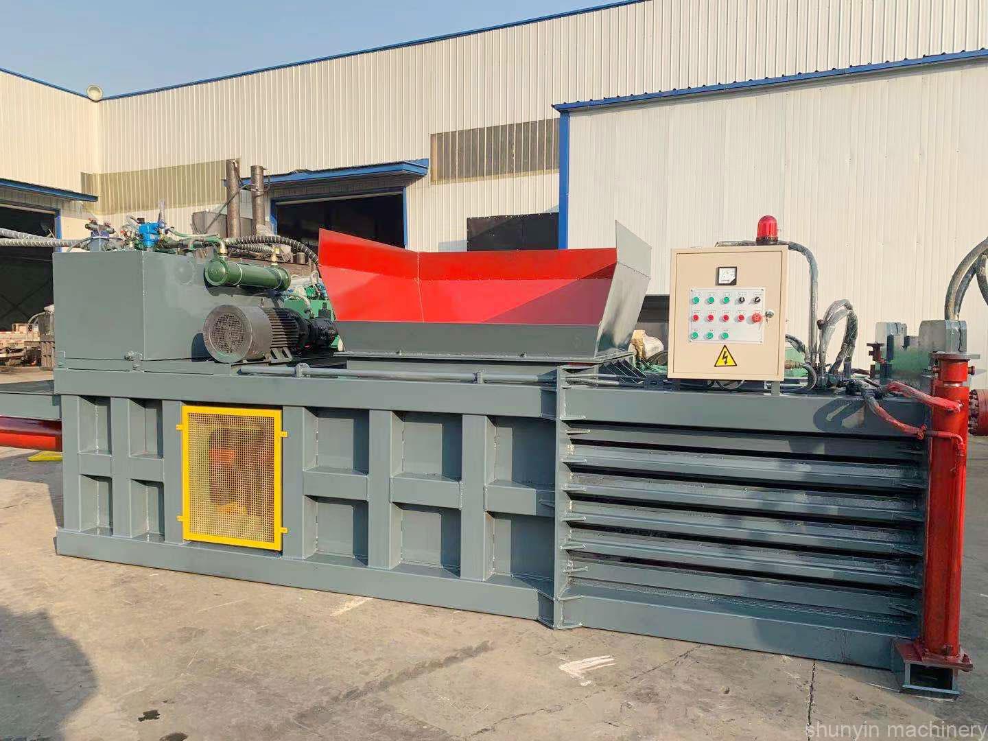 Horizontal baling machine for managing and recycling industrial materials effectively