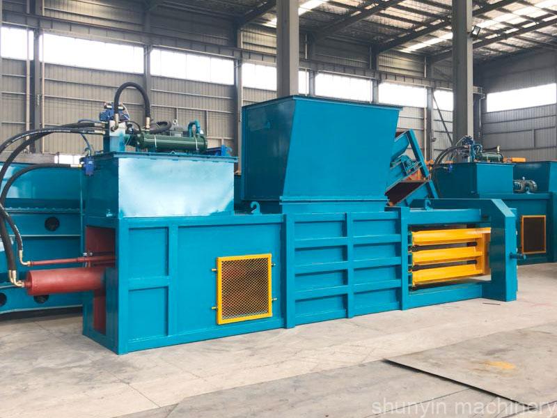 Shunyin's horizontal baling machine efficiently compresses paper waste.