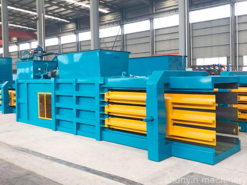 Horizontal hydraulic baling compression system for large-scale waste management