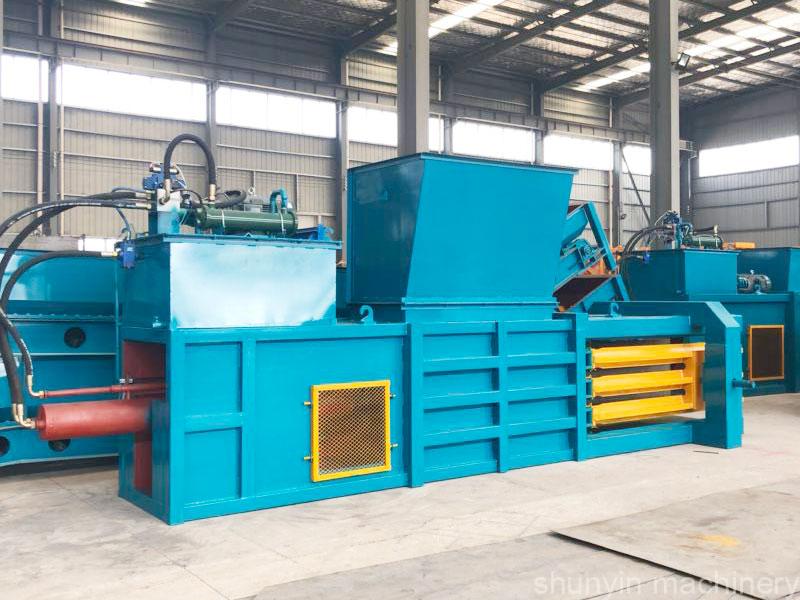 Durable horizontal baling machine for large-scale paper recycling.