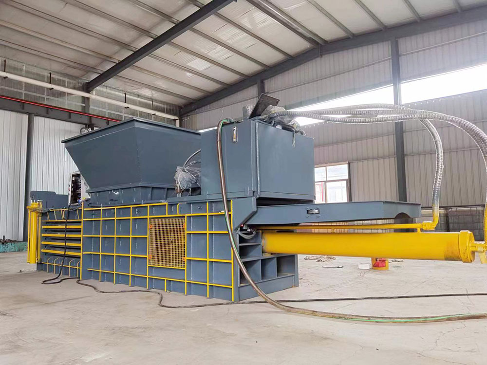 Heavy-duty cardboard baler designed for high-volume material compacting.