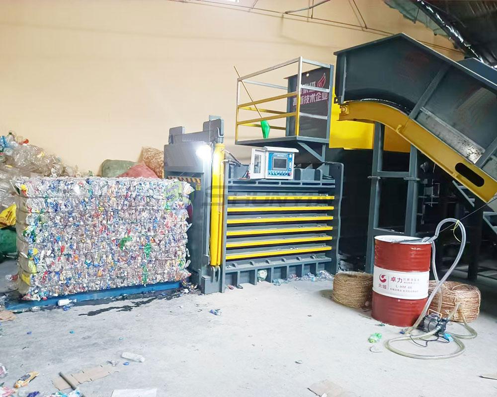 Customizable horizontal baler designed for compacting plastic waste.