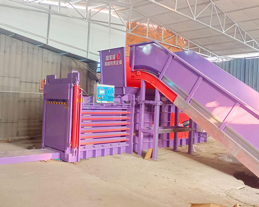 Hydraulic baler compressing recycled cardboard into compact bales for efficient storage.