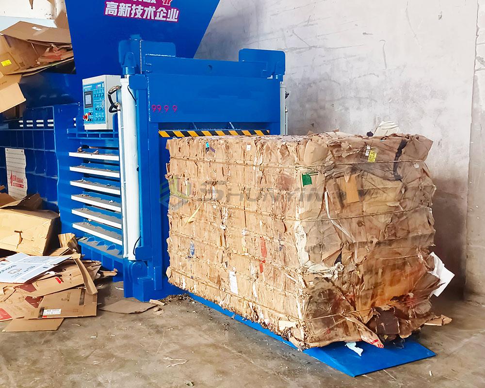 Horizontal baler specifically designed for compressing paper waste.