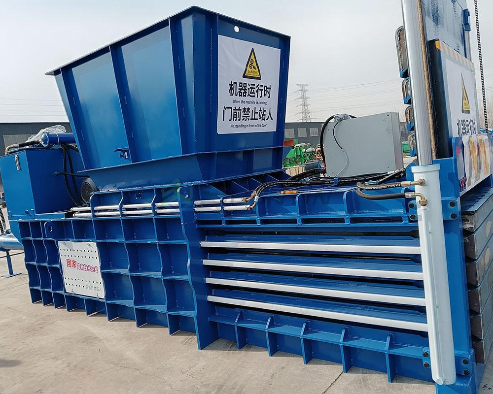 High-efficiency horizontal waste compactor for reducing material volume.