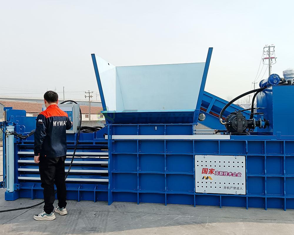 Fully automatic horizontal baler for seamless material handling and waste compaction.