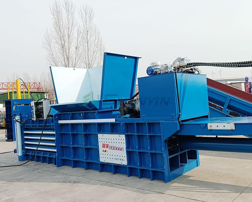 Horizontal baling machine ideal for compressing paper and cardboard waste in bulk.