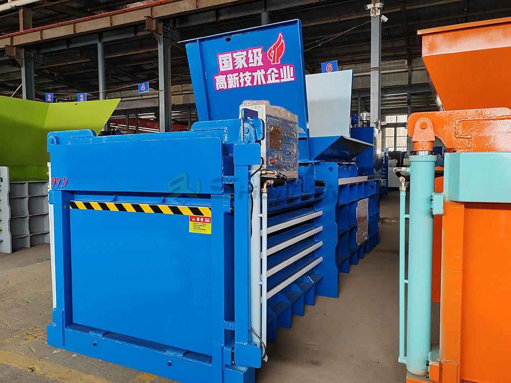 Reliable horizontal baling press for compacting paper, plastic, and metal.