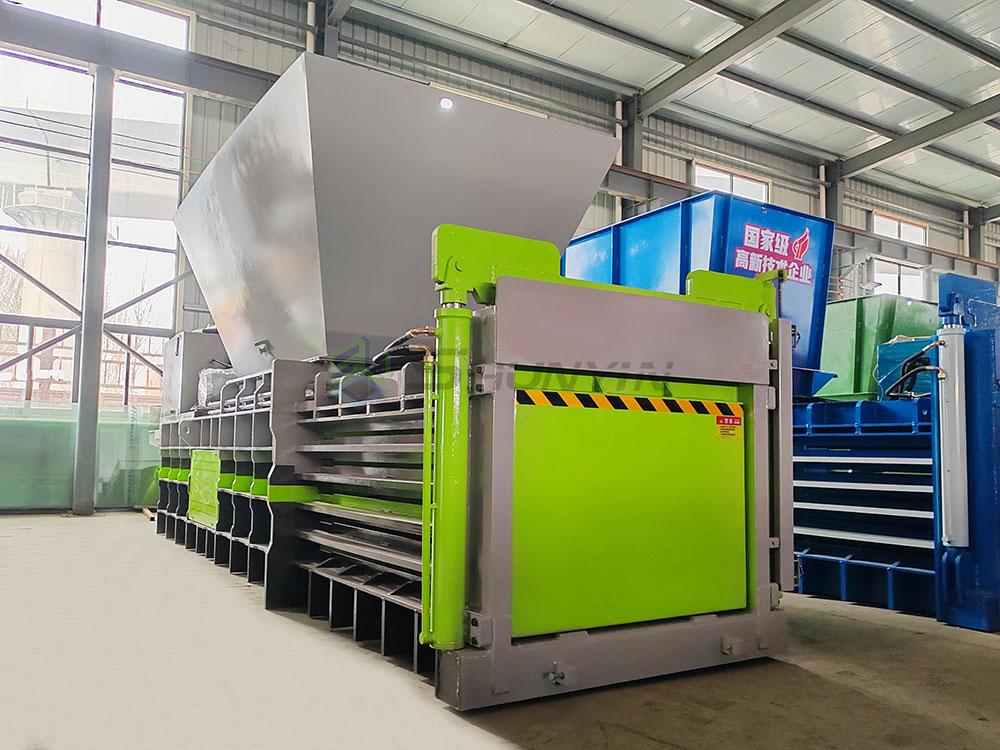 Robust horizontal baler for easy and efficient plastic recycling and compacting.