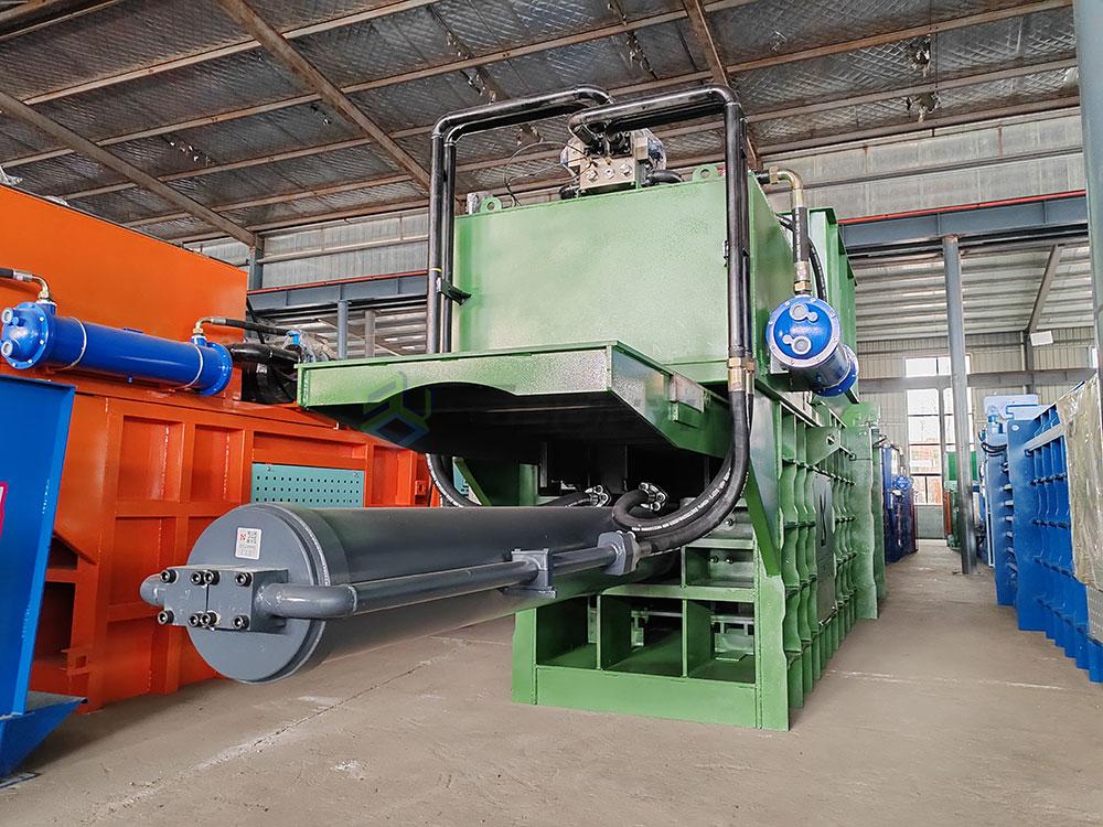 Powerful horizontal compactor baler for large-scale waste management.