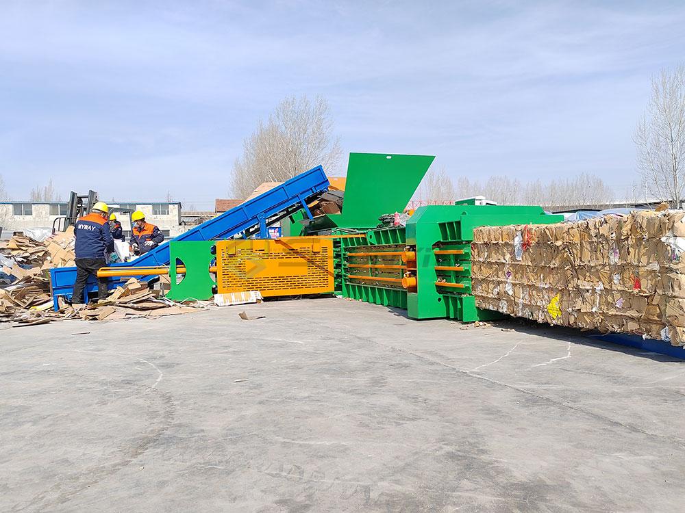 Hydraulic-driven horizontal baler for durable and high-capacity waste compression.