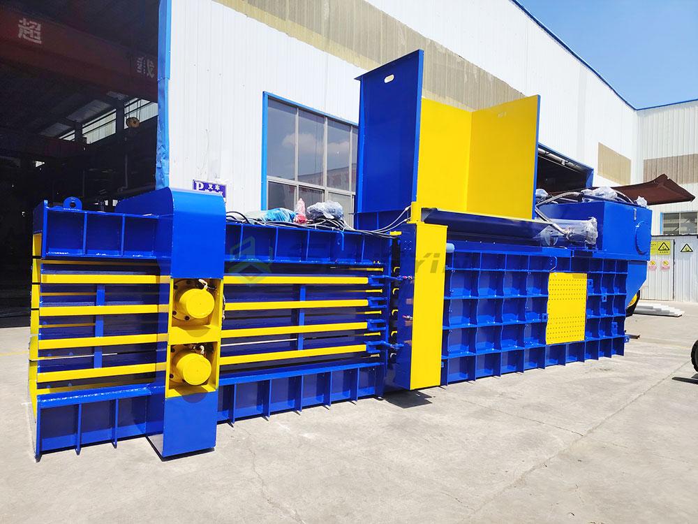 Chinese factory workers assembling horizontal hydraulic baler machine