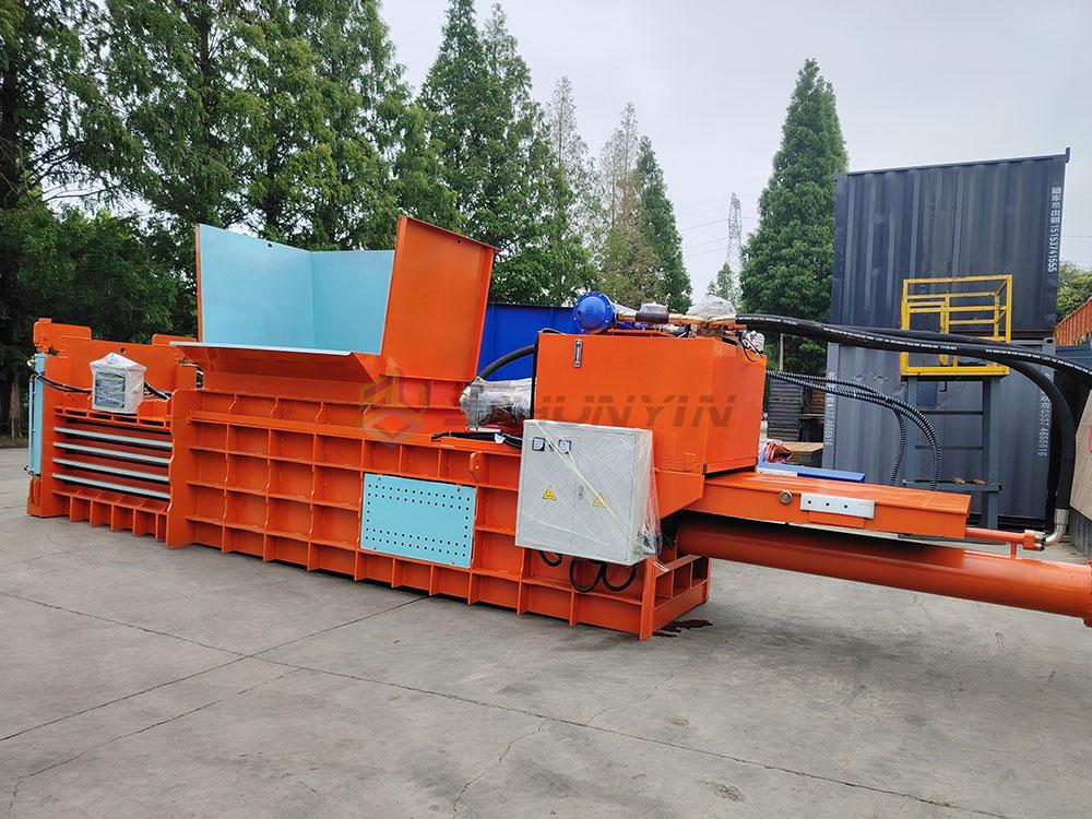 landfill trash compactor machine crushing mixed waste