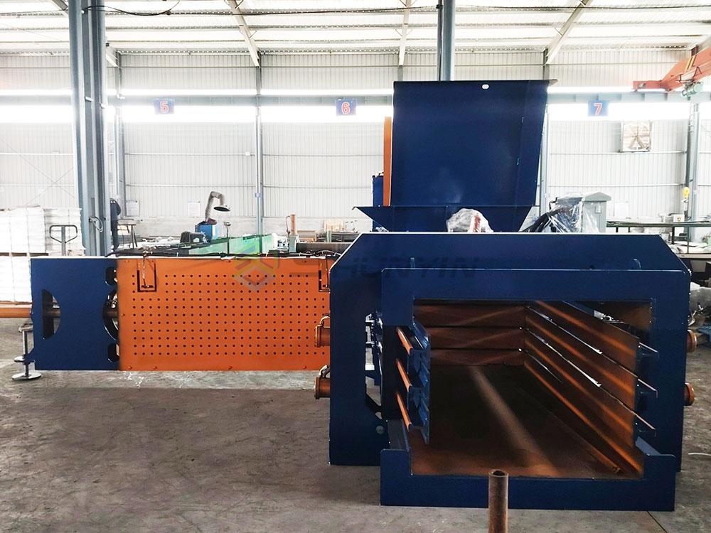 Horizontal recycling process flow diagram with baler machine