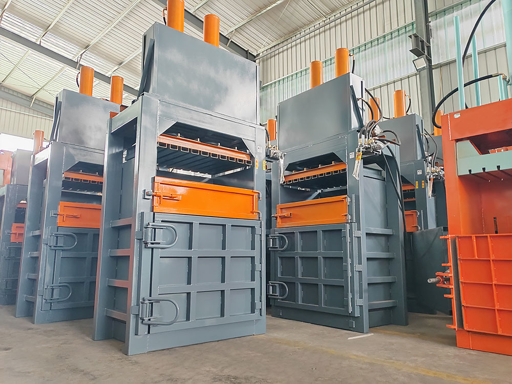 textile waste compression in vertical baler machine