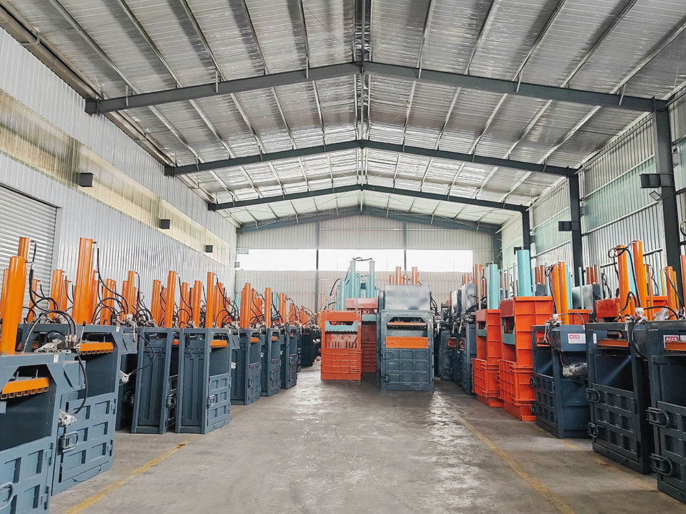 industrial hydraulic baler compacting cardboard sheets recycling plant