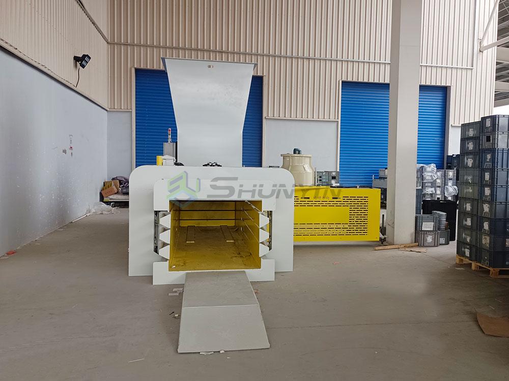 Automatic baler in operation