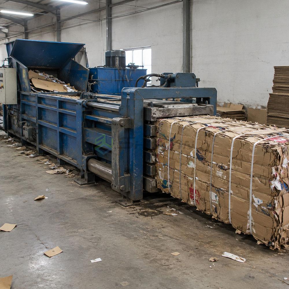 baler compressing cardboard baler compressing cardboard